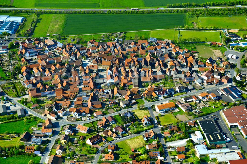 Aerial image Abtswind - Urban area with outskirts and inner city area on the edge of agricultural fields and arable land in Abtswind in the state Bavaria, Germany