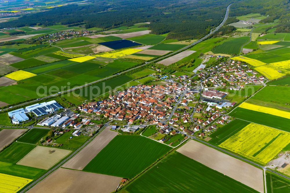 Abtswind from above - Urban area with outskirts and inner city area on the edge of agricultural fields and arable land in Abtswind in the state Bavaria, Germany