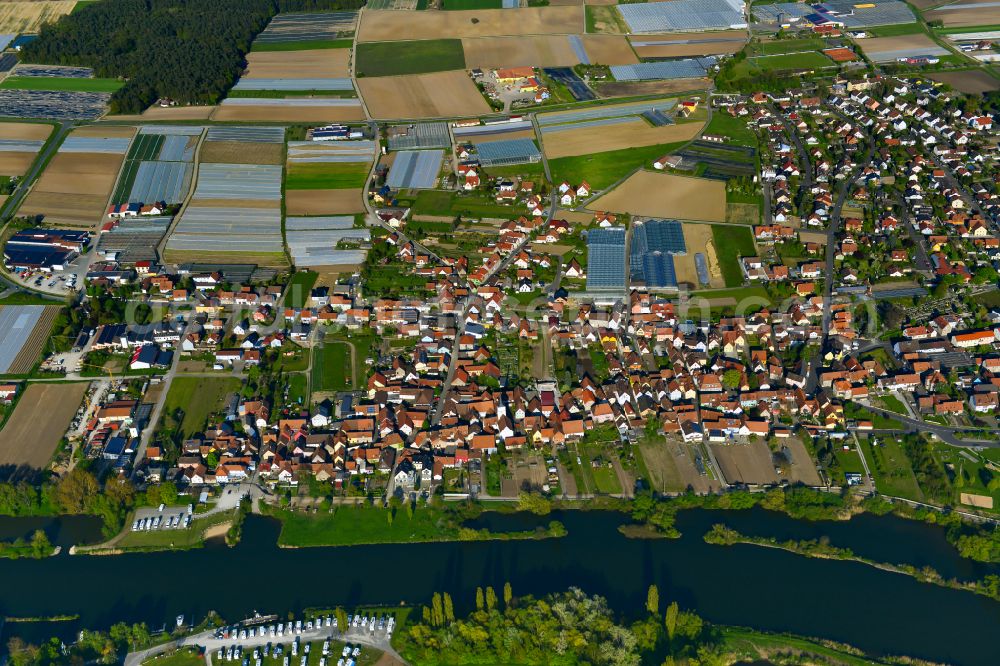 Aerial image Albertshofen - Urban area with outskirts and inner city area on the edge of agricultural fields and arable land in Albertshofen in the state Bavaria, Germany