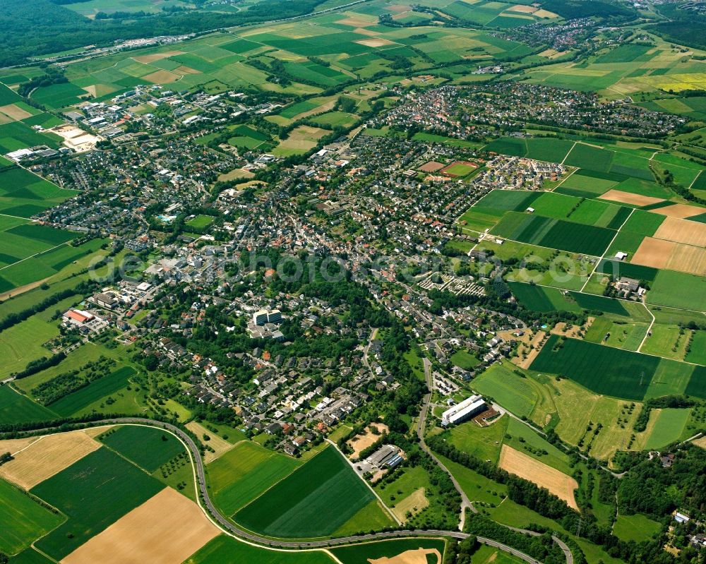 Bad Camberg from above - Urban area with outskirts and inner city area on the edge of agricultural fields and arable land in Bad Camberg in the state Hesse, Germany