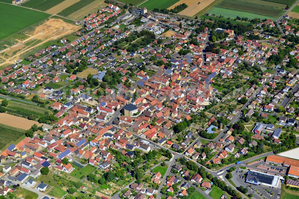 Aerial photograph Bergtheim - Urban area with outskirts and inner city area on the edge of agricultural fields and arable land in Bergtheim in the state Bavaria, Germany