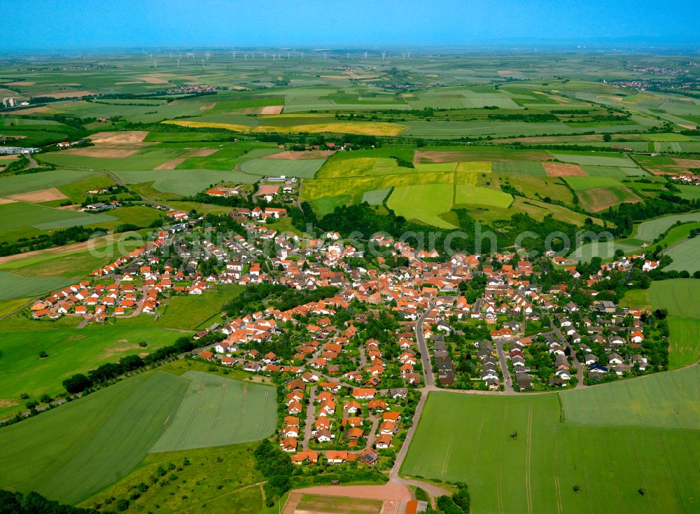 Aerial photograph Bolanden - Urban area with outskirts and inner city area on the edge of agricultural fields and arable land in Bolanden in the state Rhineland-Palatinate, Germany