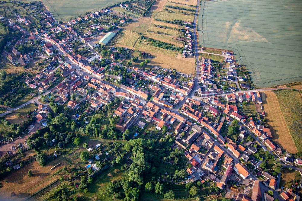 Brücken (Helme) from above - Urban area with outskirts and inner city area on the edge of agricultural fields and arable land in Bruecken (Helme) in the state Saxony-Anhalt, Germany