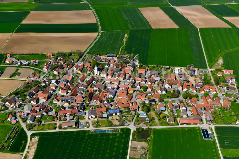 Aerial image Dornheim - Urban area with outskirts and inner city area on the edge of agricultural fields and arable land in Dornheim in the state Bavaria, Germany