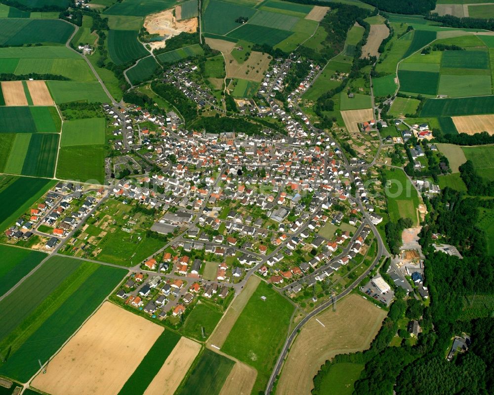 Aerial photograph Eisenbach - Urban area with outskirts and inner city area on the edge of agricultural fields and arable land in Eisenbach in the state Hesse, Germany