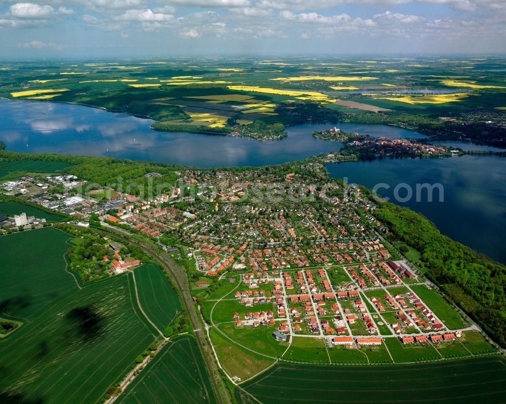 Farchauer Mühle from the bird's eye view: Urban area with outskirts and inner city area on the edge of agricultural fields and arable land in Farchauer Mühle in the state Schleswig-Holstein, Germany