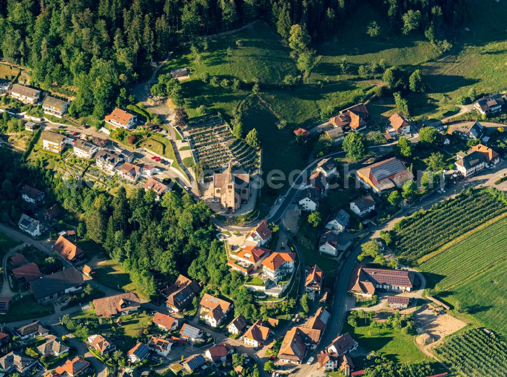 Fischerbach from above - Urban area with outskirts and inner city area on the edge of agricultural fields and arable land in Fischerbach in the state Baden-Wuerttemberg, Germany