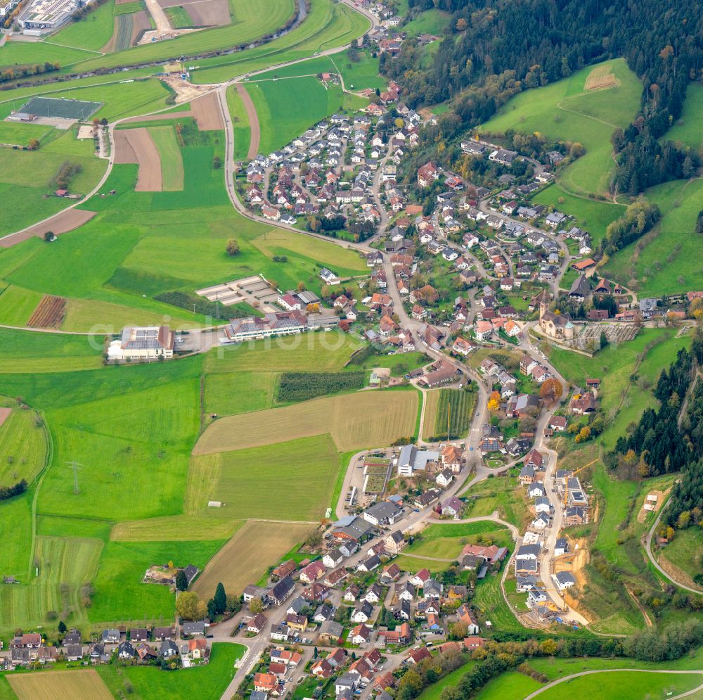 Aerial photograph Fischerbach - Urban area with outskirts and inner city area on the edge of agricultural fields and arable land in Fischerbach in the state Baden-Wuerttemberg, Germany