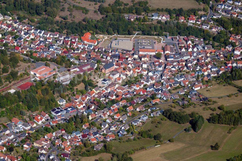 Aerial image Frammersbach - Urban area with outskirts and inner city area on the edge of agricultural fields and arable land in Frammersbach in the state Bavaria, Germany