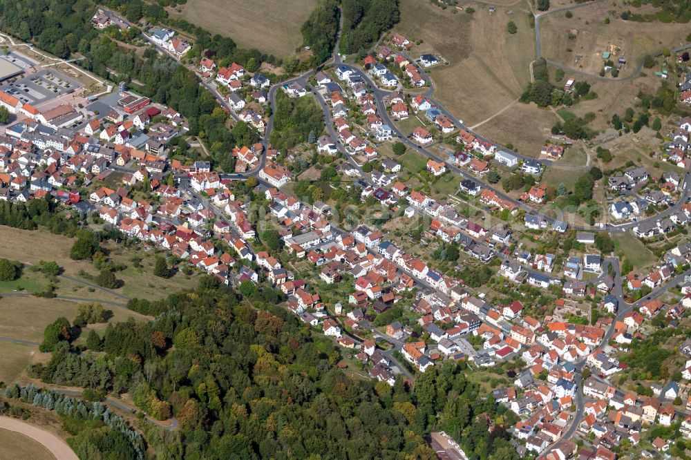 Frammersbach from above - Urban area with outskirts and inner city area on the edge of agricultural fields and arable land in Frammersbach in the state Bavaria, Germany