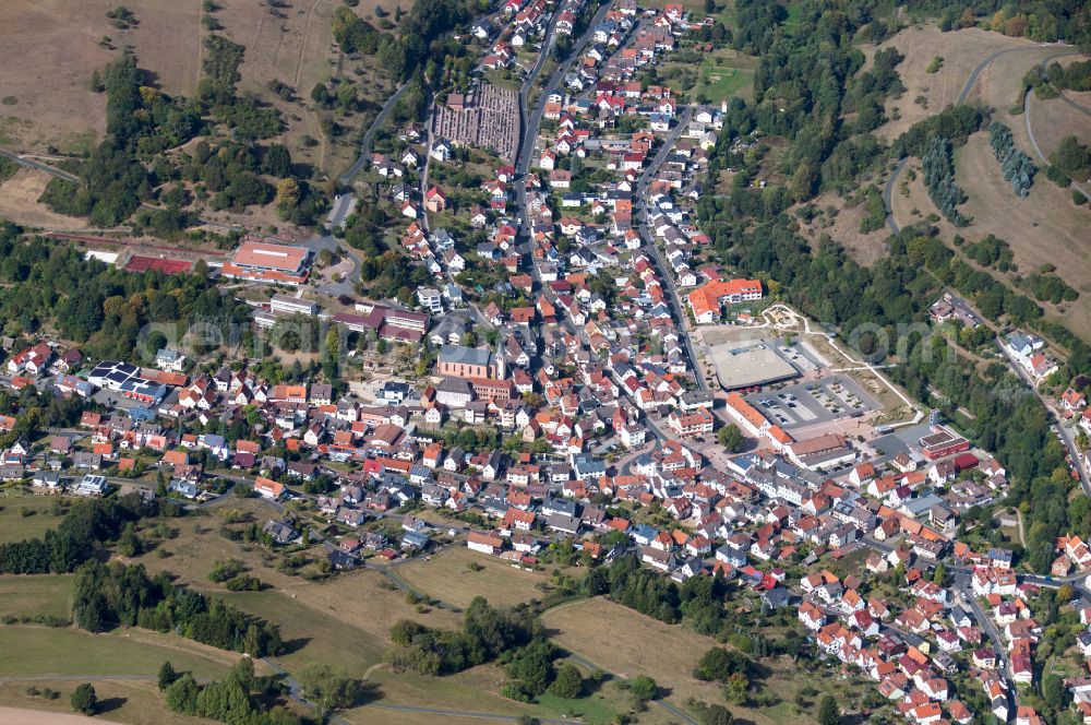 Frammersbach from the bird's eye view: Urban area with outskirts and inner city area on the edge of agricultural fields and arable land in Frammersbach in the state Bavaria, Germany