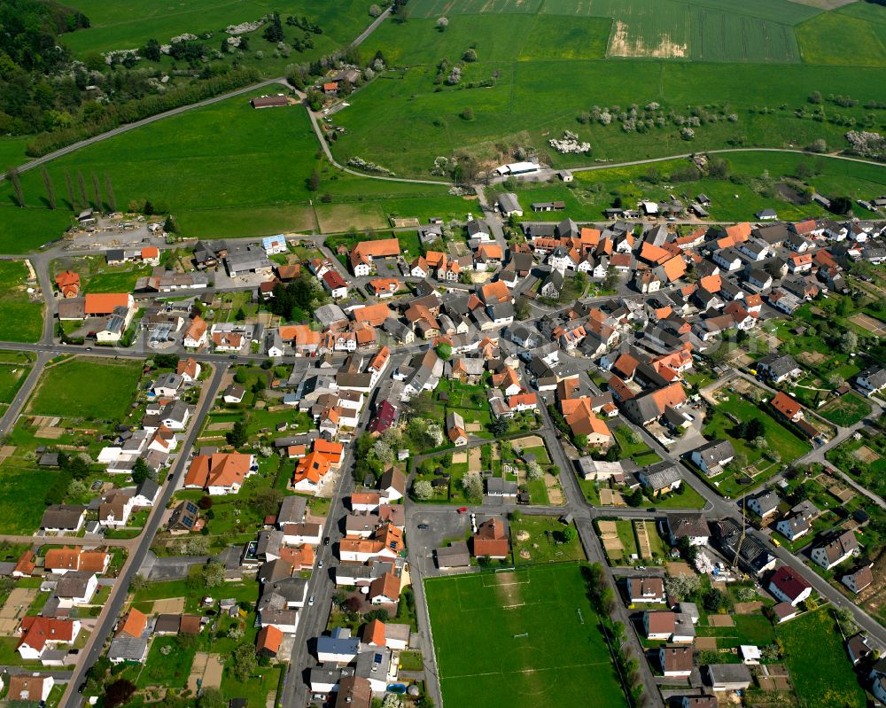 Aerial image Geilshausen - Urban area with outskirts and inner city area on the edge of agricultural fields and arable land in Geilshausen in the state Hesse, Germany