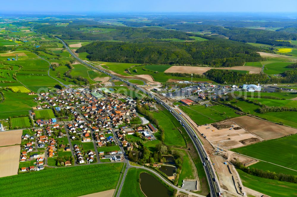 Geiselwind from the bird's eye view: Urban area with outskirts and inner city area on the edge of agricultural fields and arable land in Geiselwind in the state Bavaria, Germany