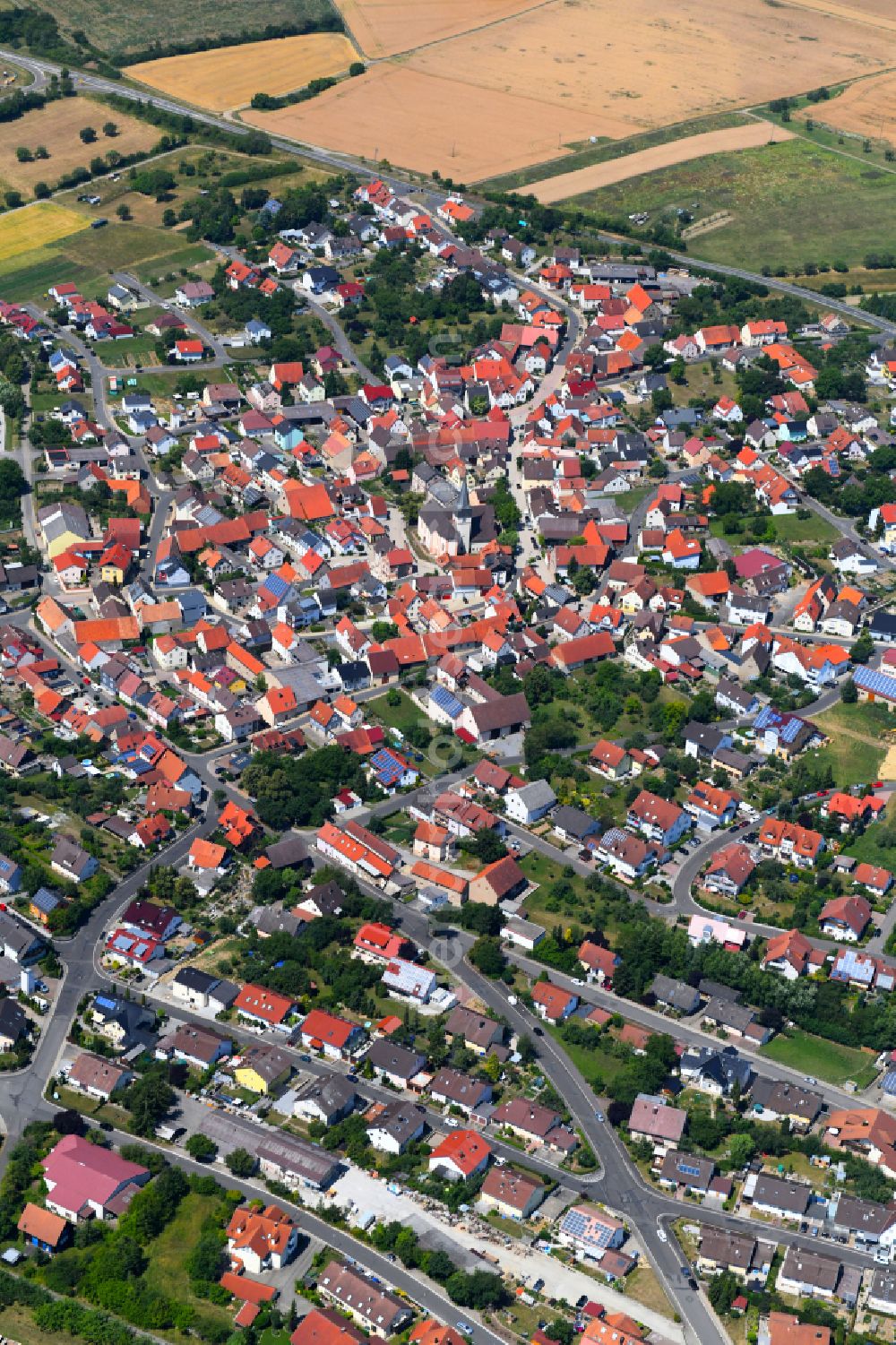 Gerchsheim from above - Urban area with outskirts and inner city area on the edge of agricultural fields and arable land in Gerchsheim in the state Baden-Wuerttemberg, Germany