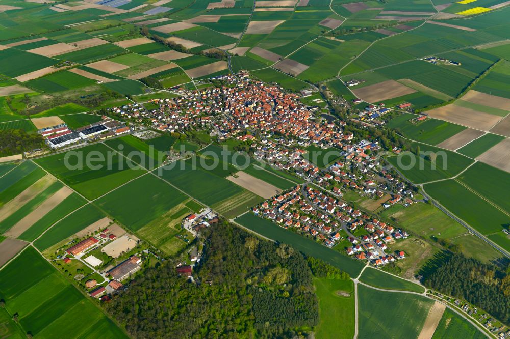 Großlangheim from above - Urban area with outskirts and inner city area on the edge of agricultural fields and arable land in Großlangheim in the state Bavaria, Germany