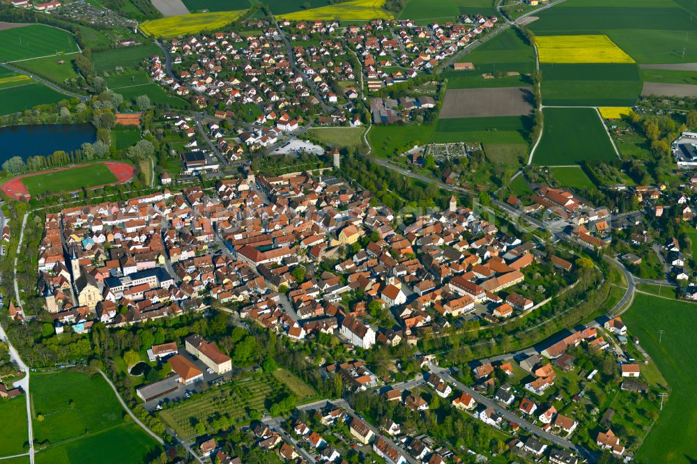 Aerial image Hellmitzheim - Urban area with outskirts and inner city area on the edge of agricultural fields and arable land in Hellmitzheim in the state Bavaria, Germany