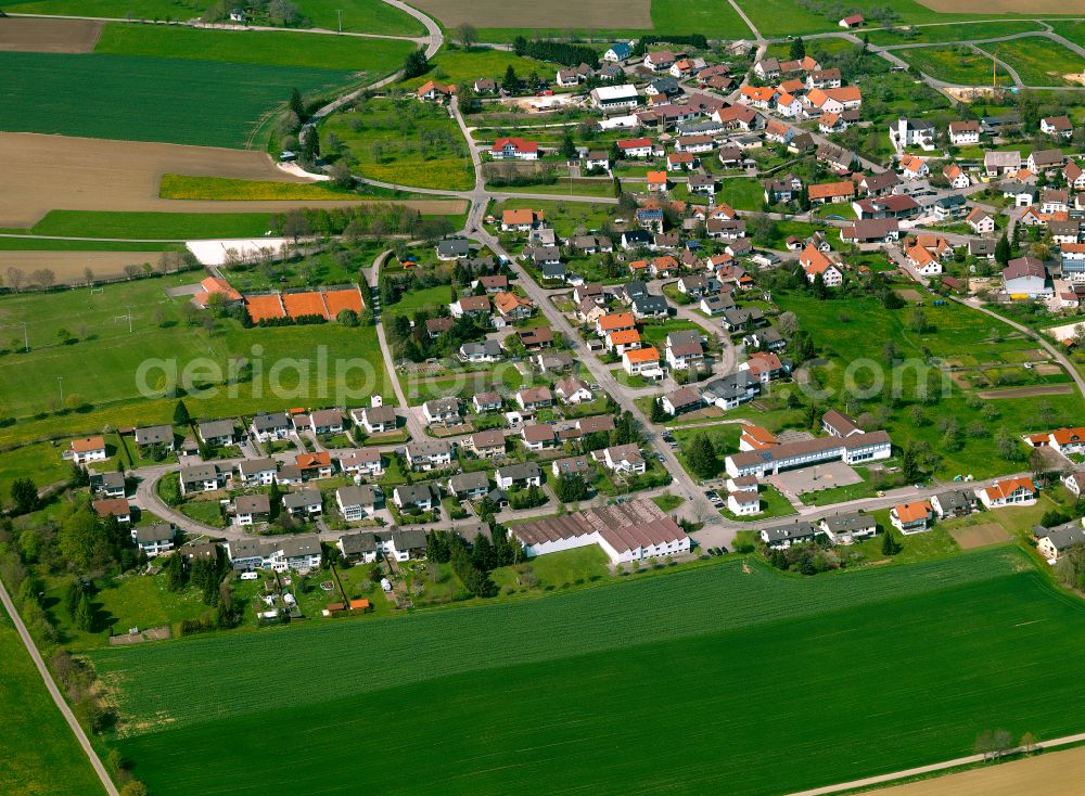 Aerial image Heroldstatt - Urban area with outskirts and inner city area on the edge of agricultural fields and arable land in Heroldstatt in the state Baden-Wuerttemberg, Germany