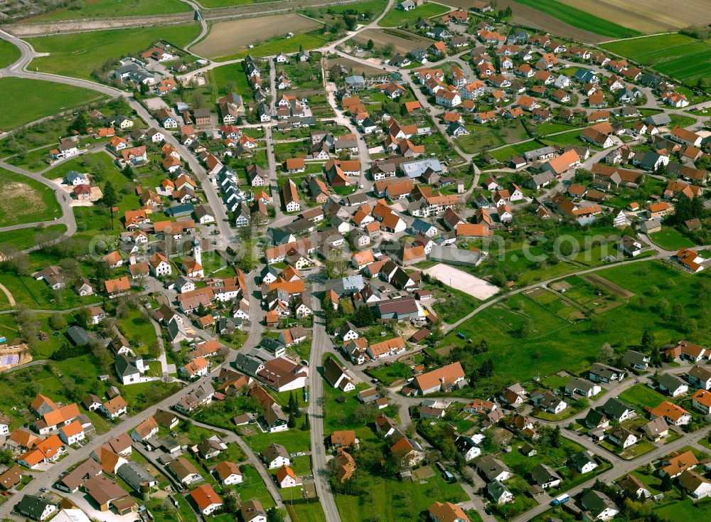 Aerial photograph Heroldstatt - Urban area with outskirts and inner city area on the edge of agricultural fields and arable land in Heroldstatt in the state Baden-Wuerttemberg, Germany