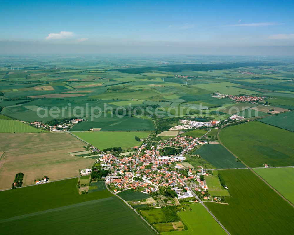 Heudeber from the bird's eye view: Urban area with outskirts and inner city area on the edge of agricultural fields and arable land in Heudeber in the state Saxony-Anhalt, Germany