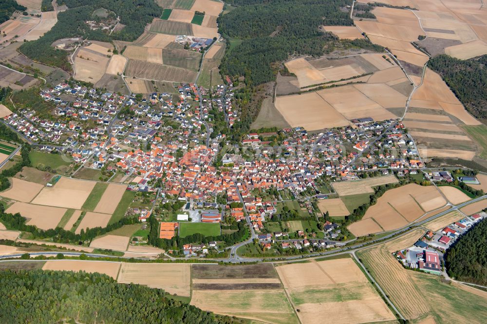 Karbach from the bird's eye view: Urban area with outskirts and inner city area on the edge of agricultural fields and arable land in Karbach in the state Bavaria, Germany