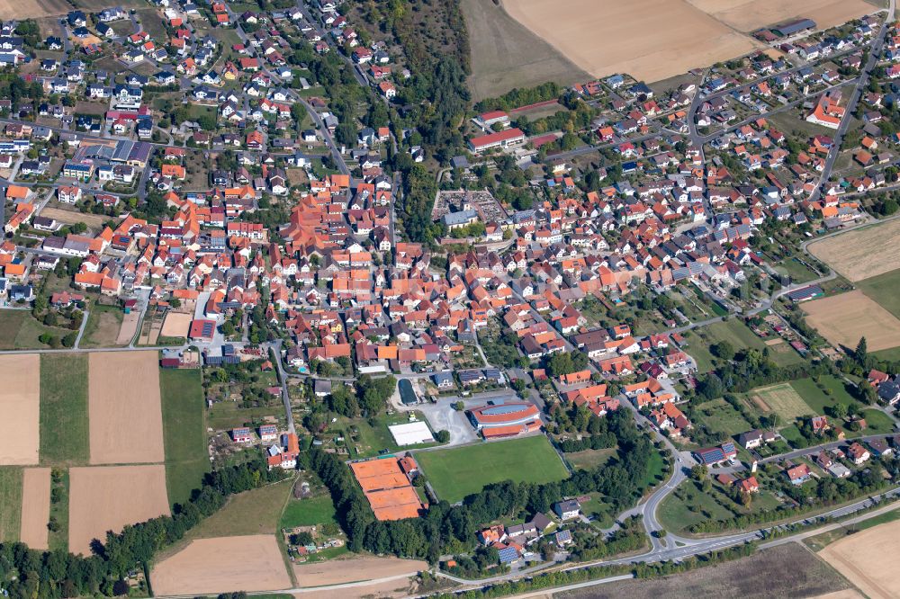 Aerial photograph Karbach - Urban area with outskirts and inner city area on the edge of agricultural fields and arable land in Karbach in the state Bavaria, Germany