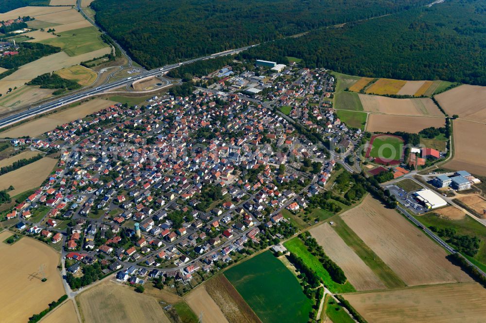 Kist from the bird's eye view: Urban area with outskirts and inner city area on the edge of agricultural fields and arable land in Kist in the state Bavaria, Germany