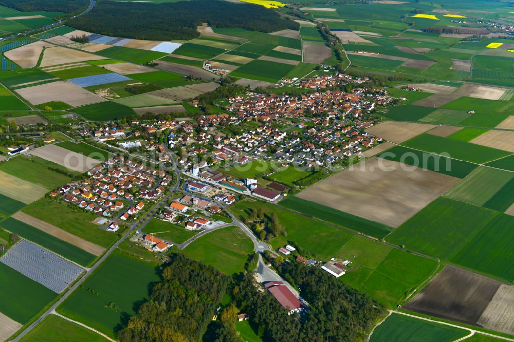 Aerial image Kleinlangheim - Urban area with outskirts and inner city area on the edge of agricultural fields and arable land in Kleinlangheim in the state Bavaria, Germany