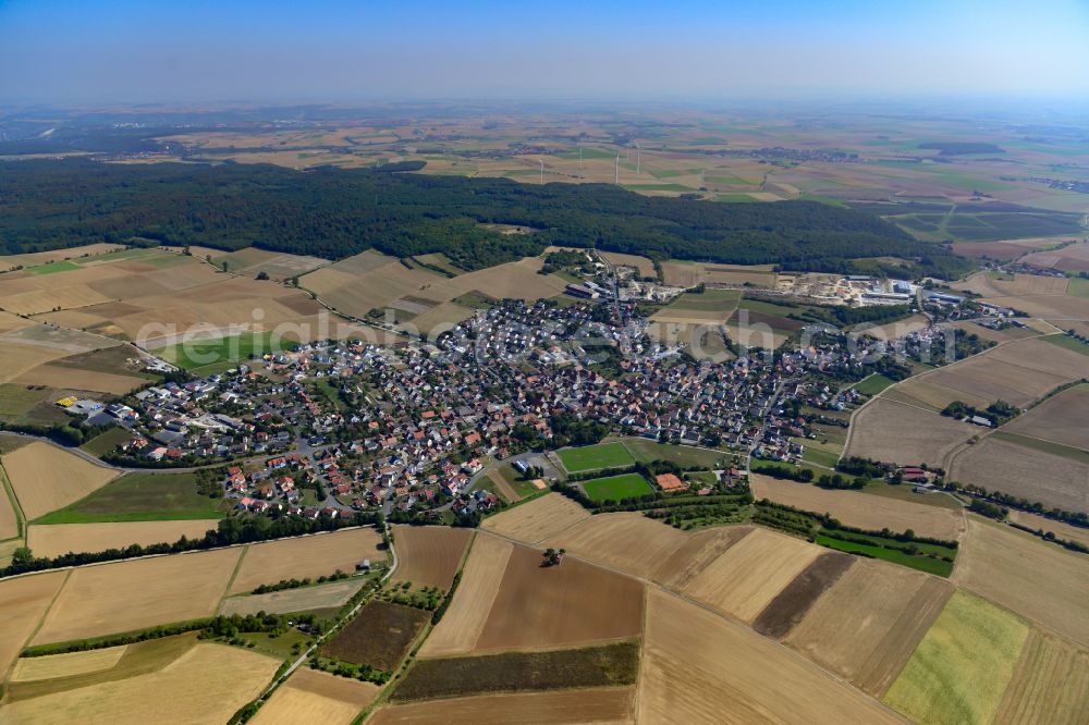 Aerial image Kleinrinderfeld - Urban area with outskirts and inner city area on the edge of agricultural fields and arable land in Kleinrinderfeld in the state Bavaria, Germany