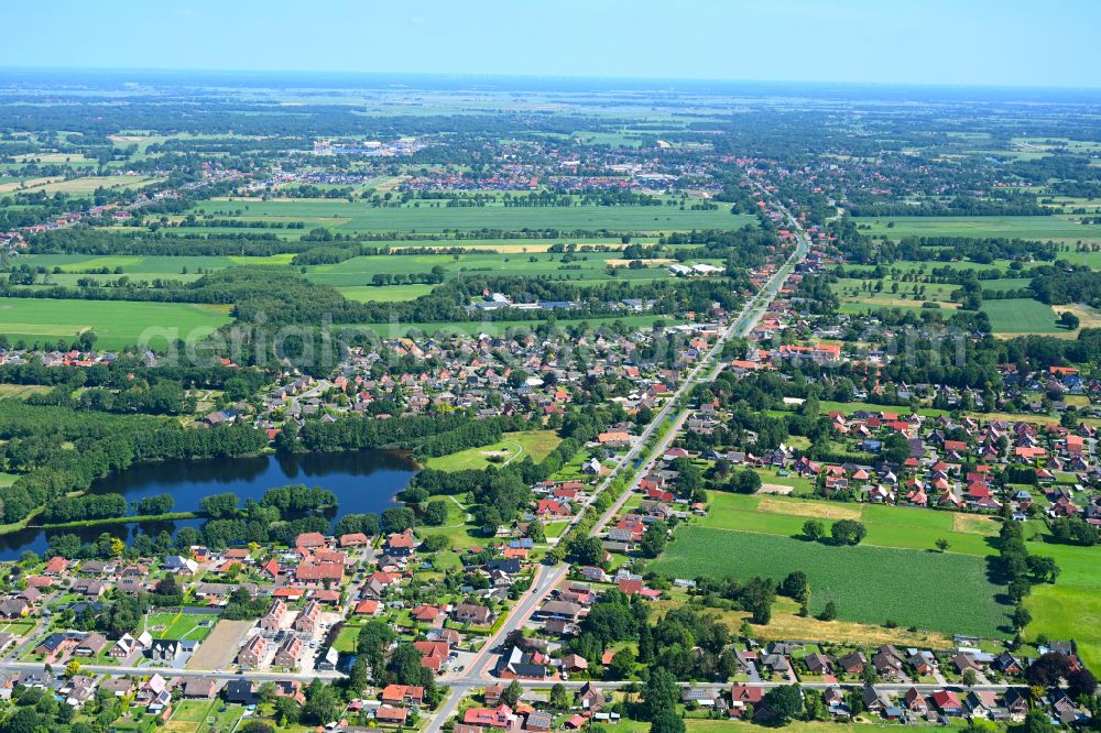 Aerial image Klostermoor - Urban area with outskirts and inner city area on the edge of agricultural fields and arable land in Klostermoor in the state Lower Saxony, Germany