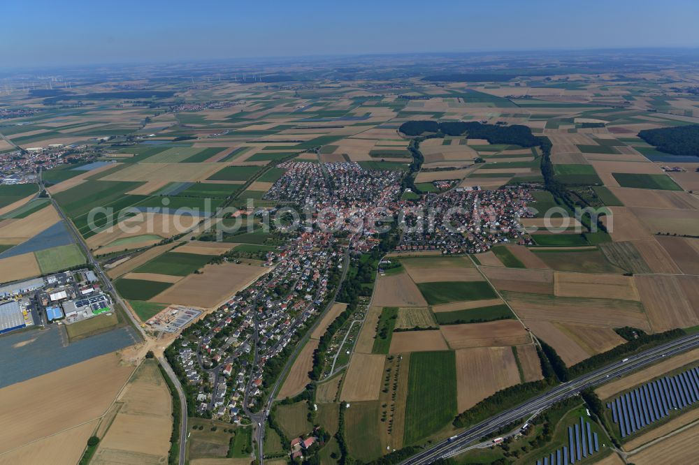 Aerial image Kürnach - Urban area with outskirts and inner city area on the edge of agricultural fields and arable land in Kürnach in the state Bavaria, Germany