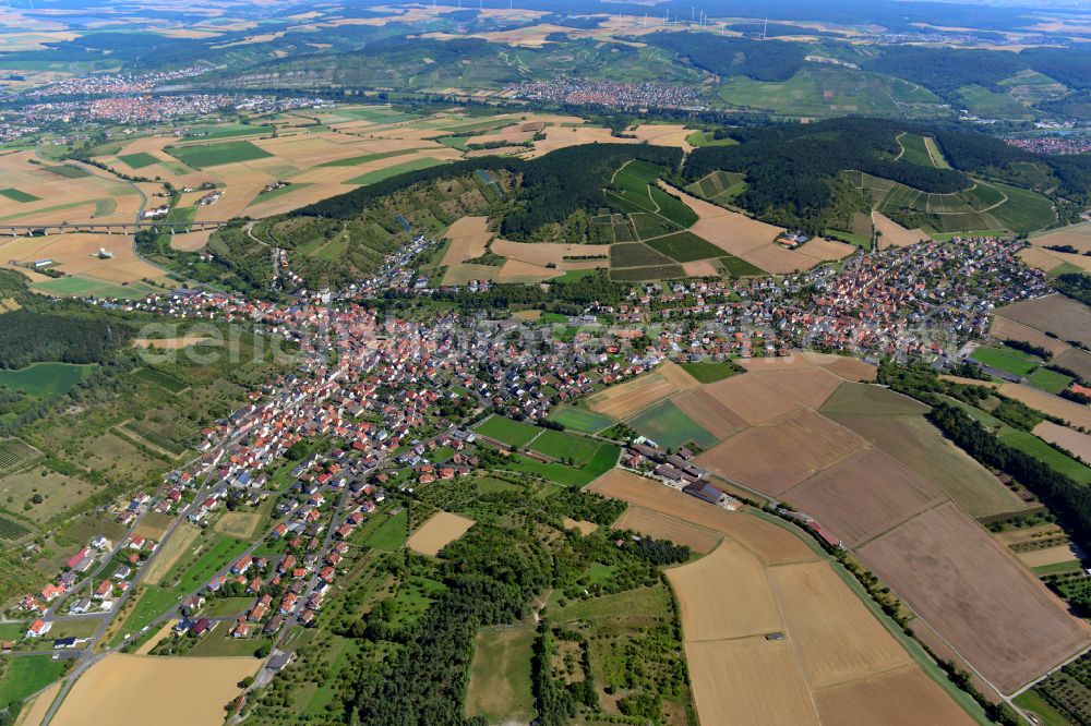 Aerial photograph Leinach - Urban area with outskirts and inner city area on the edge of agricultural fields and arable land in Leinach in the state Bavaria, Germany