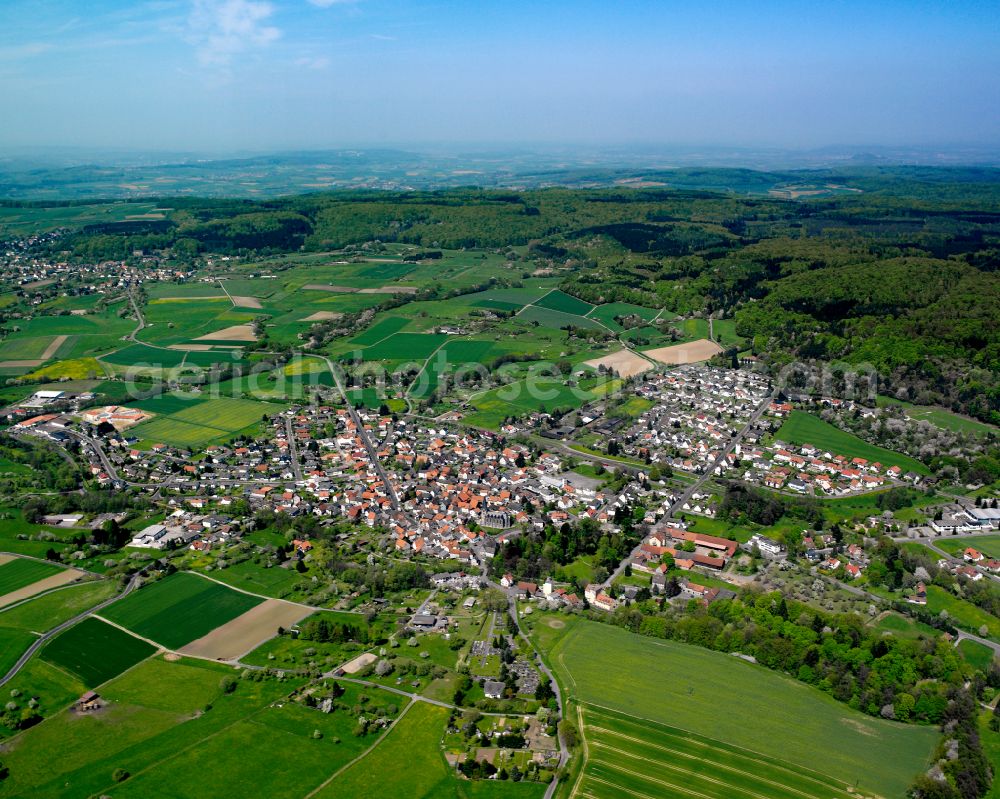 Aerial image Londorf - Urban area with outskirts and inner city area on the edge of agricultural fields and arable land in Londorf in the state Hesse, Germany