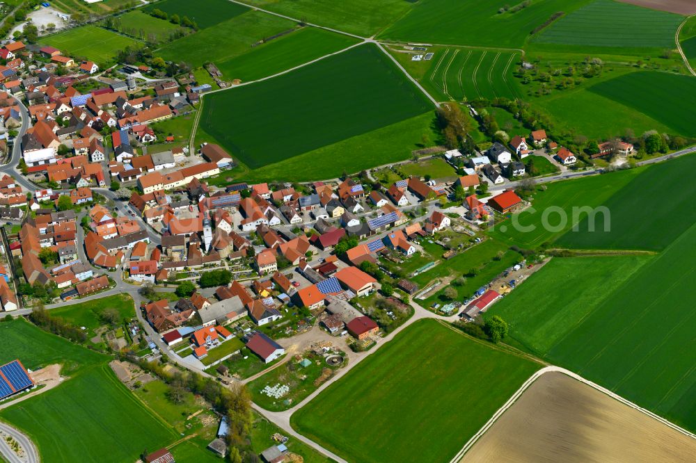 Nenzenheim from the bird's eye view: Urban area with outskirts and inner city area on the edge of agricultural fields and arable land in Nenzenheim in the state Bavaria, Germany