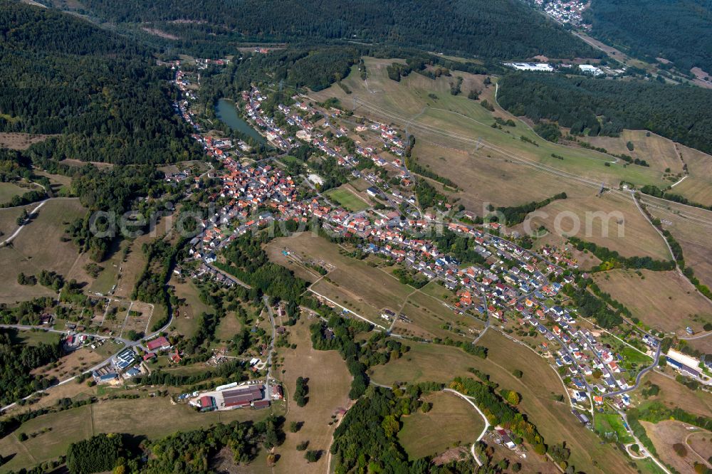 Neuhütten from the bird's eye view: Urban area with outskirts and inner city area on the edge of agricultural fields and arable land in Neuhütten in the state Bavaria, Germany