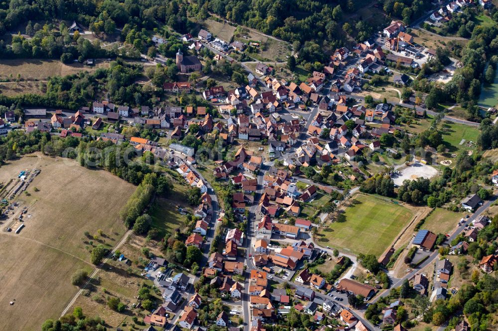 Aerial image Neuhütten - Urban area with outskirts and inner city area on the edge of agricultural fields and arable land in Neuhütten in the state Bavaria, Germany