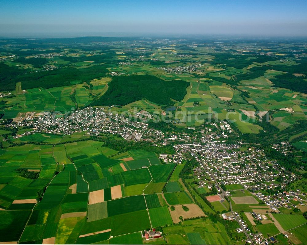 Niederhadamar from above - Urban area with outskirts and inner city area on the edge of agricultural fields and arable land in Niederhadamar in the state Hesse, Germany