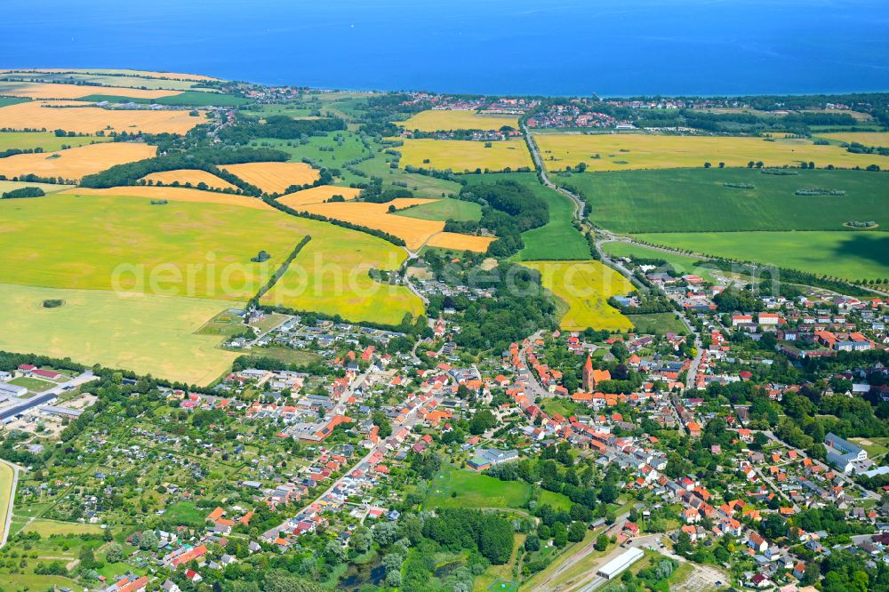 Niederklütz from the bird's eye view: Urban area with outskirts and inner city area on the edge of agricultural fields and arable land in Niederklütz in the state Mecklenburg - Western Pomerania, Germany