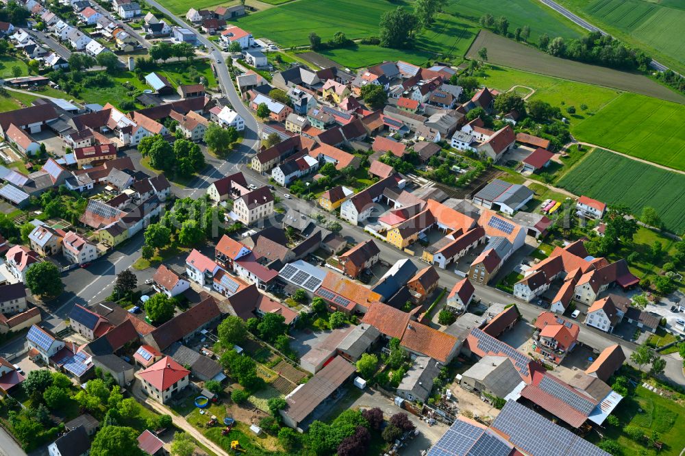 Aerial photograph Oberspiesheim - Urban area with outskirts and inner city area on the edge of agricultural fields and arable land in Oberspiesheim in the state Bavaria, Germany