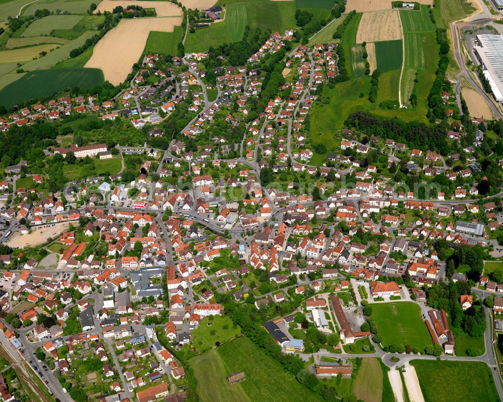 Ochsenhausen from the bird's eye view: Urban area with outskirts and inner city area on the edge of agricultural fields and arable land in Ochsenhausen in the state Baden-Wuerttemberg, Germany