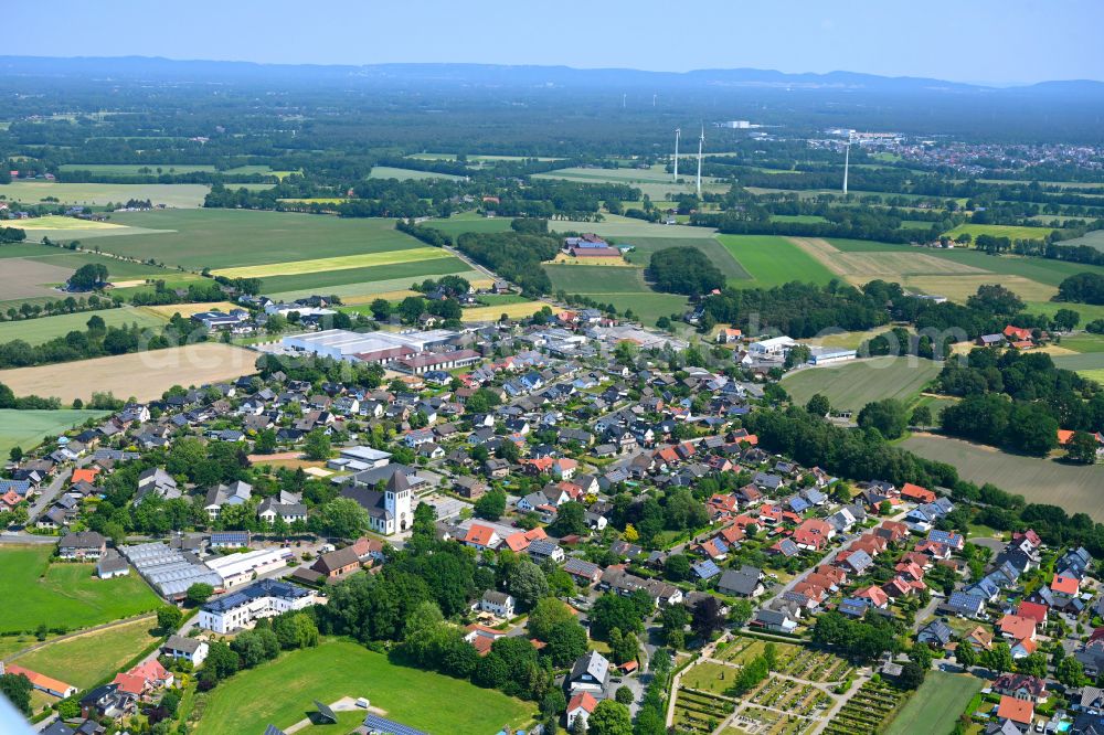 Aerial image Ostenland - Urban area with outskirts and inner city area on the edge of agricultural fields and arable land in Ostenland in the state North Rhine-Westphalia, Germany