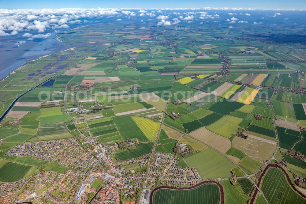 Otterndorf from the bird's eye view: Urban area with outskirts and inner city area on the edge of agricultural fields and arable land in Otterndorf in the state Lower Saxony, Germany