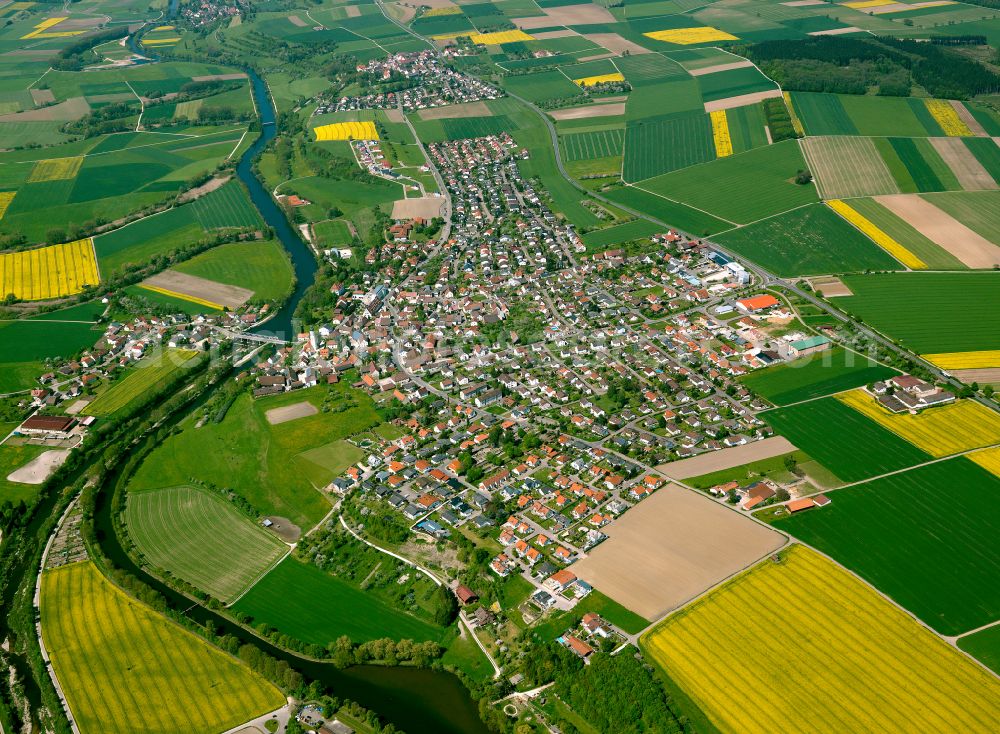 Öpfingen from the bird's eye view: Urban area with outskirts and inner city area on the edge of agricultural fields and arable land in Öpfingen in the state Baden-Wuerttemberg, Germany