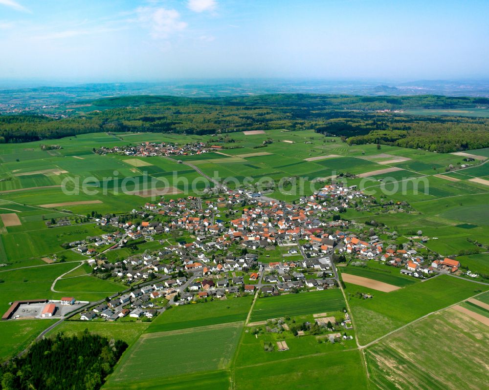 Rüddingshausen from the bird's eye view: Urban area with outskirts and inner city area on the edge of agricultural fields and arable land in Rüddingshausen in the state Hesse, Germany