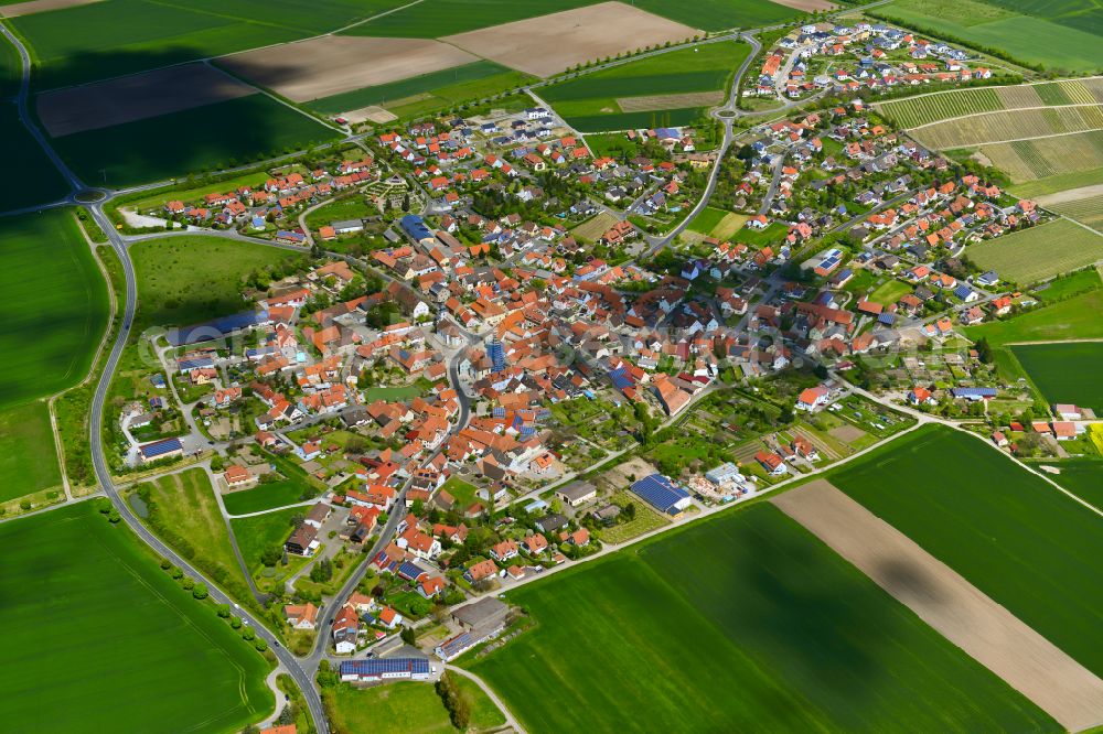 Rödelsee from the bird's eye view: Urban area with outskirts and inner city area on the edge of agricultural fields and arable land in Rödelsee in the state Bavaria, Germany