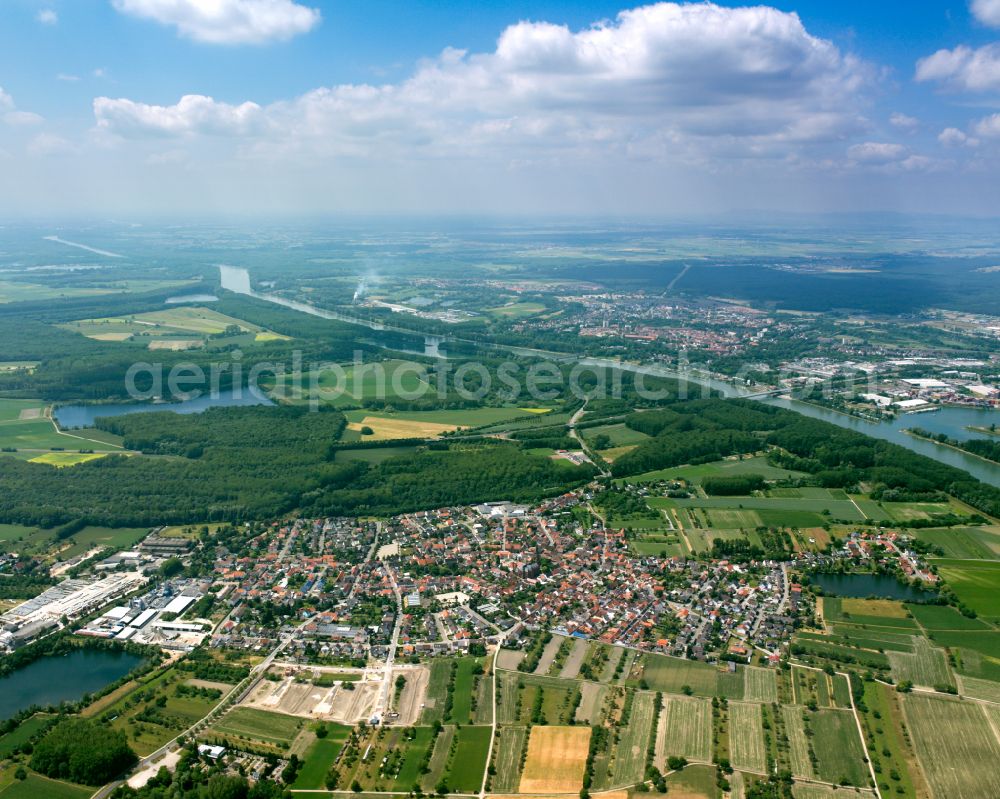 Aerial image Rheinsheim - Urban area with outskirts and inner city area on the edge of agricultural fields and arable land in Rheinsheim in the state Baden-Wuerttemberg, Germany