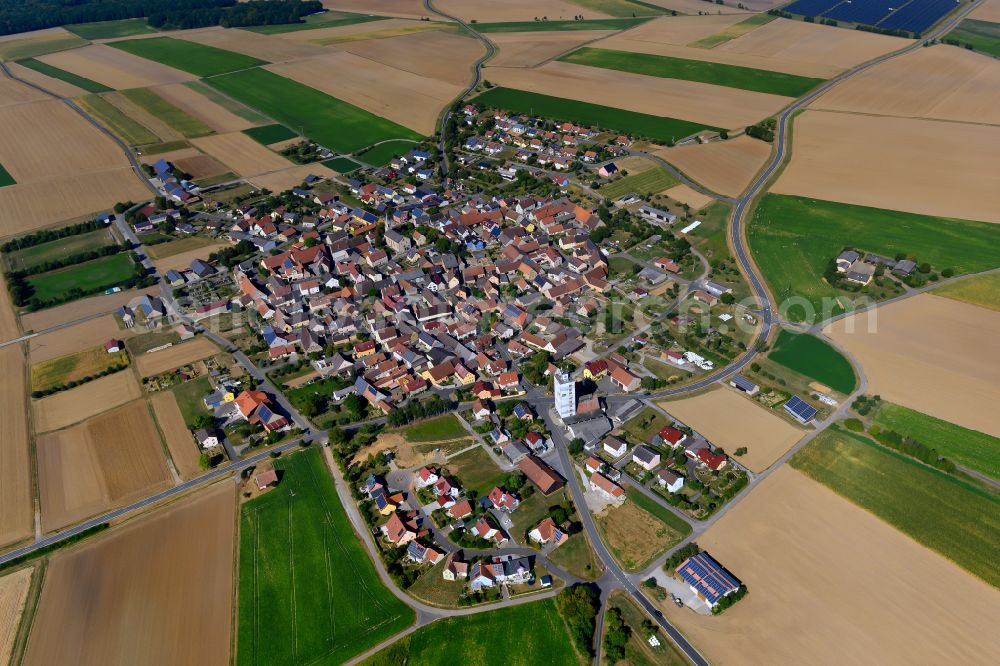 Aerial image Riedenheim - Urban area with outskirts and inner city area on the edge of agricultural fields and arable land in Riedenheim in the state Bavaria, Germany