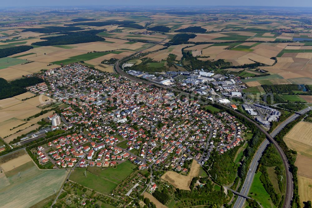 Aerial image Rottendorf - Urban area with outskirts and inner city area on the edge of agricultural fields and arable land in Rottendorf in the state Bavaria, Germany