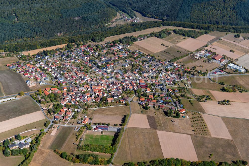 Schollbrunn from above - Urban area with outskirts and inner city area on the edge of agricultural fields and arable land in Schollbrunn in the state Bavaria, Germany