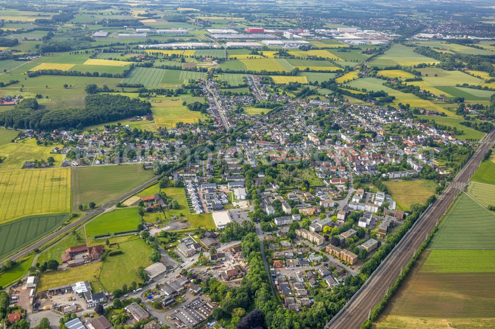 Selmigerheide from the bird's eye view: Urban area with outskirts and inner city area on the edge of agricultural fields and arable land in Selmigerheide in the state North Rhine-Westphalia, Germany