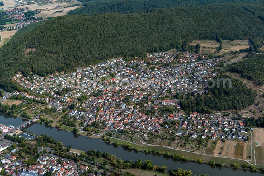 Sendelbach from the bird's eye view: Urban area with outskirts and inner city area on the edge of agricultural fields and arable land in Sendelbach in the state Bavaria, Germany